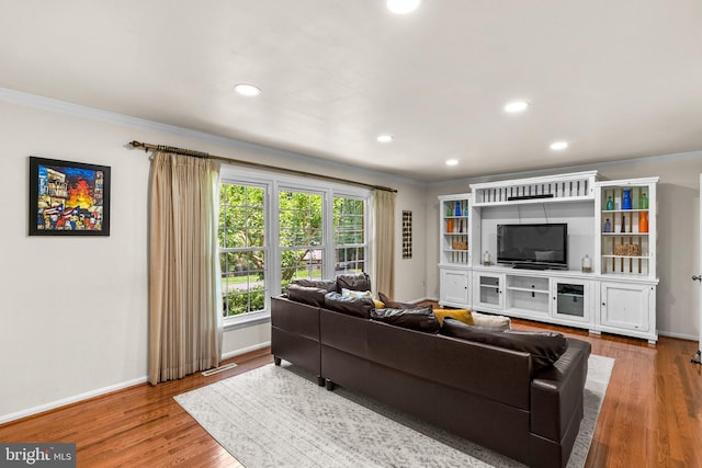 24411 Kakae Dr, Damascus, MD 20872 - living area featuring ornamental molding, recessed lighting, and wood finished floors