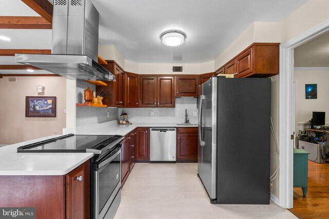 24411 Kakae Dr, Damascus, MD 20872 - kitchen with appliances with stainless steel finishes, island exhaust hood, light countertops, tasteful backsplash, and light wood finished floors