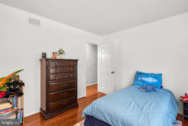 24411 Kakae Dr, Damascus, MD 20872 - bedroom featuring wood finished floors and baseboards
