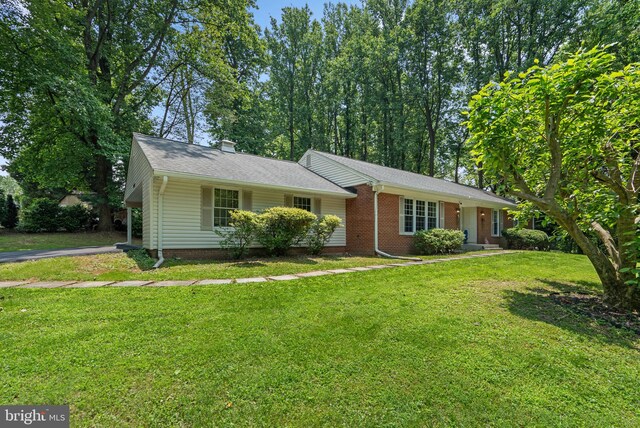 24411 Kakae Dr, Damascus, MD 20872 - ranch-style house with a front lawn and a chimney