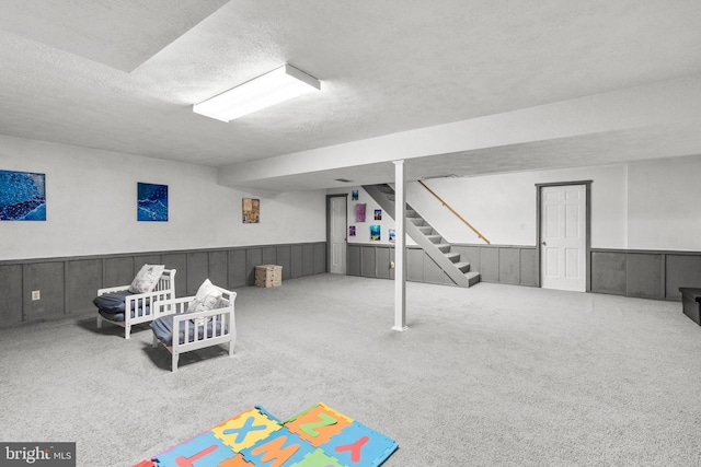 24411 Kakae Dr, Damascus, MD 20872 - recreation room featuring a textured ceiling, carpet, and wainscoting