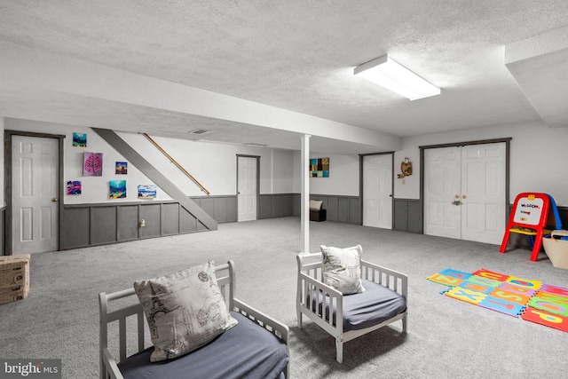 24411 Kakae Dr, Damascus, MD 20872 - sitting room with a textured ceiling, wainscoting, and carpet