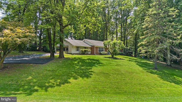 24411 Kakae Dr, Damascus, MD 20872 - view of front facade with a front yard and asphalt driveway