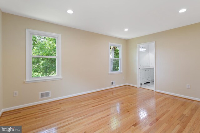 11013 Lopa Ln, North Potomac, MD 20878 - empty room featuring healthy amount of natural light, light wood finished floors, and recessed lighting