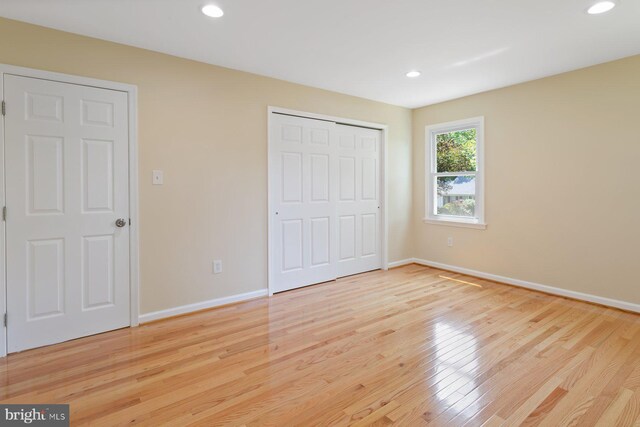 11013 Lopa Ln, North Potomac, MD 20878 - unfurnished bedroom with light wood-type flooring, recessed lighting, and a closet