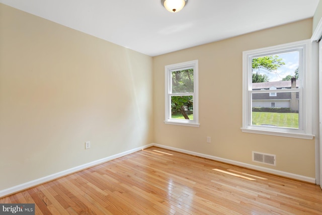 11013 Lopa Ln, North Potomac, MD 20878 - unfurnished room with hardwood / wood-style floors and healthy amount of natural light