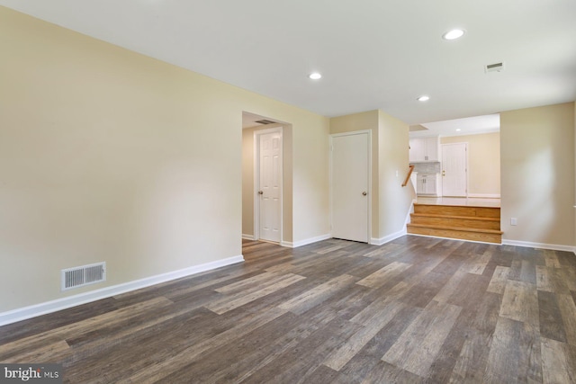 11013 Lopa Ln, North Potomac, MD 20878 - unfurnished room with stairway, dark wood finished floors, and recessed lighting