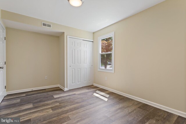 11013 Lopa Ln, North Potomac, MD 20878 - unfurnished bedroom featuring dark wood-style floors and a closet