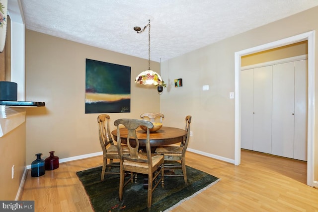 84 Windbrooke Cir Unit 84, Gaithersburg, MD 20879 - dining room with a textured ceiling and wood finished floors