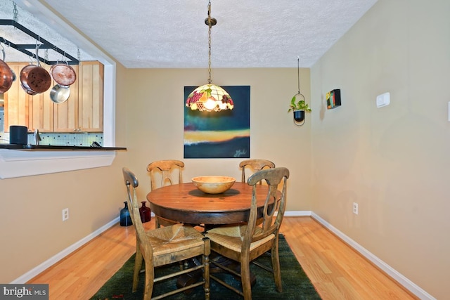 84 Windbrooke Cir Unit 84, Gaithersburg, MD 20879 - dining room with light wood finished floors and a textured ceiling