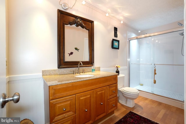 84 Windbrooke Cir Unit 84, Gaithersburg, MD 20879 - bathroom with wood finished floors, a shower stall, and vanity