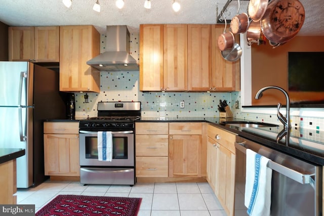 84 Windbrooke Cir Unit 84, Gaithersburg, MD 20879 - kitchen with wall chimney range hood, appliances with stainless steel finishes, light brown cabinets, and a textured ceiling