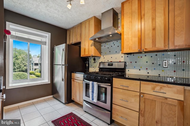 84 Windbrooke Cir Unit 84, Gaithersburg, MD 20879 - kitchen featuring wall chimney range hood, stainless steel appliances, backsplash, dark countertops, and light tile patterned floors