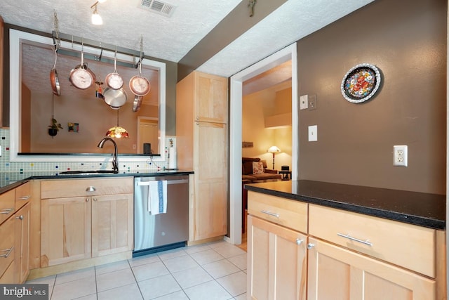 84 Windbrooke Cir Unit 84, Gaithersburg, MD 20879 - kitchen with stainless steel dishwasher, light brown cabinetry, light tile patterned flooring, and a textured ceiling