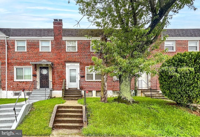 4735 Chatford Ave, Baltimore, MD 21206 - multi unit property featuring brick siding, a chimney, a front yard, and a shingled roof