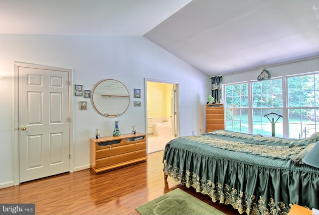 300 Bonnie Meadow Cir, Reisterstown, MD 21136 - bedroom featuring vaulted ceiling, wood finished floors, and connected bathroom