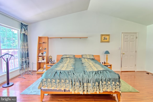 300 Bonnie Meadow Cir, Reisterstown, MD 21136 - bedroom featuring vaulted ceiling, multiple windows, and wood finished floors