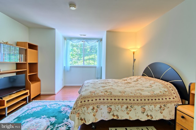 300 Bonnie Meadow Cir, Reisterstown, MD 21136 - bedroom featuring baseboards and wood finished floors