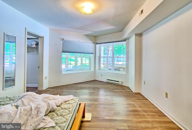 300 Bonnie Meadow Cir, Reisterstown, MD 21136 - bedroom featuring a baseboard radiator and wood finished floors
