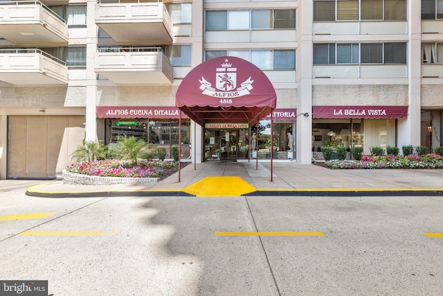 4515 Willard Ave Unit 1111S, Chevy Chase, MD 20815 - view of building exterior featuring uncovered parking