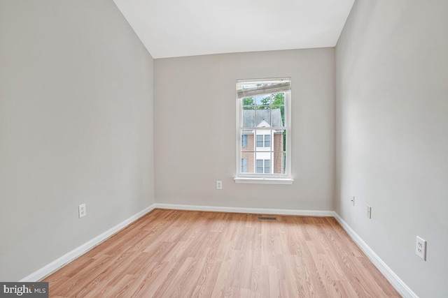 1403 Peregrine Path, Arnold, MD 21012 - empty room featuring light wood-style flooring and vaulted ceiling