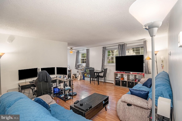 250 Ridge Pike Unit 58, Lafayette Hill, PA 19444 - living area with a textured ceiling, wood finished floors, and a ceiling fan