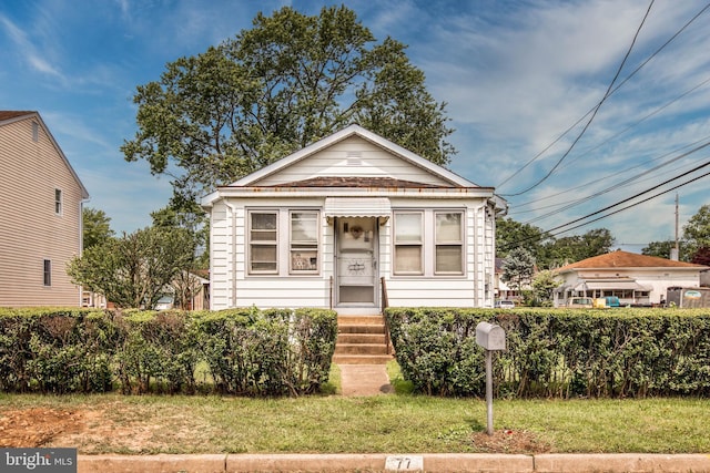 77 Atkins Ave, Hamilton, NJ 08610 - shotgun-style home with entry steps and a front yard