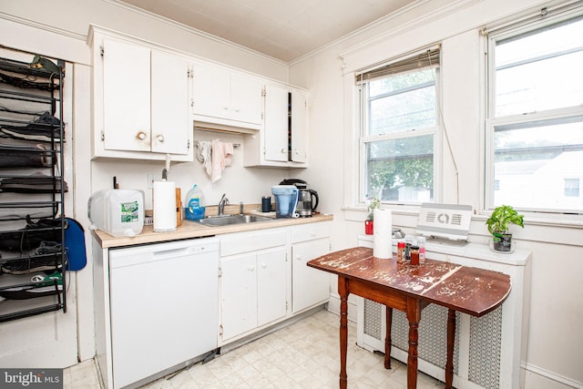 77 Atkins Ave, Hamilton, NJ 08610 - kitchen with dishwasher, light flooring, light countertops, white cabinets, and crown molding