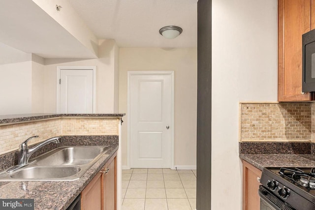 851 N Glebe Rd Unit 1418, Arlington, VA 22203 - kitchen with backsplash, light tile patterned floors, brown cabinetry, and black appliances