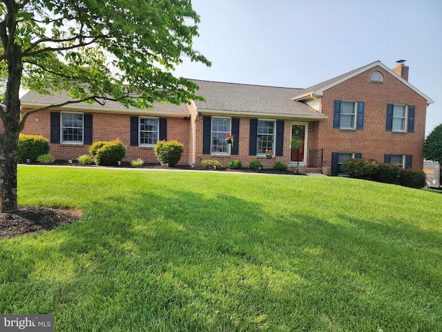 631 Cornell Ave, Hagerstown, MD 21742 - view of front of home featuring brick siding, a front lawn, a shingled roof, and a chimney