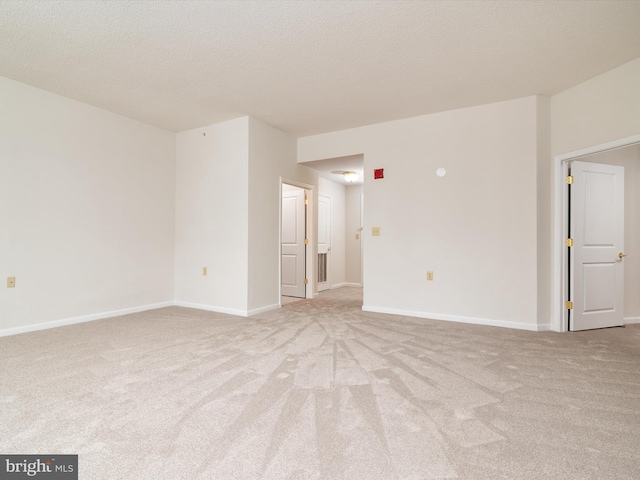 7101 Bay Front Dr Unit 204, Annapolis, MD 21403 - spare room featuring light colored carpet and a textured ceiling