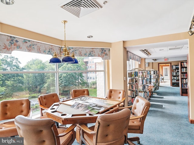 7101 Bay Front Dr Unit 204, Annapolis, MD 21403 - carpeted dining area featuring a chandelier