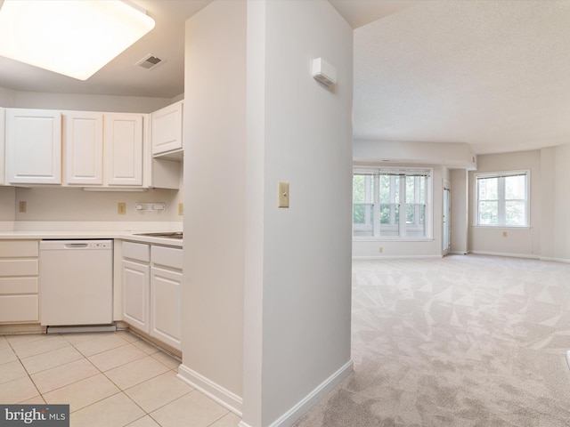7101 Bay Front Dr Unit 204, Annapolis, MD 21403 - kitchen with white dishwasher, white cabinets, open floor plan, and light countertops