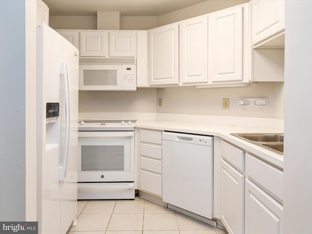 7101 Bay Front Dr Unit 204, Annapolis, MD 21403 - kitchen featuring white appliances, white cabinetry, light tile patterned flooring, and light countertops