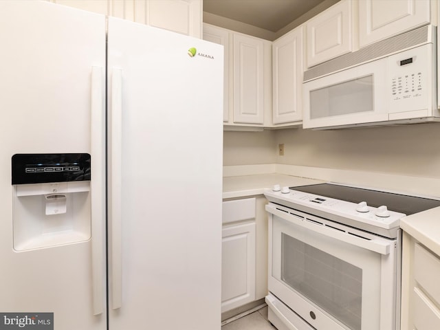 7101 Bay Front Dr Unit 204, Annapolis, MD 21403 - kitchen with white appliances, white cabinetry, and light countertops