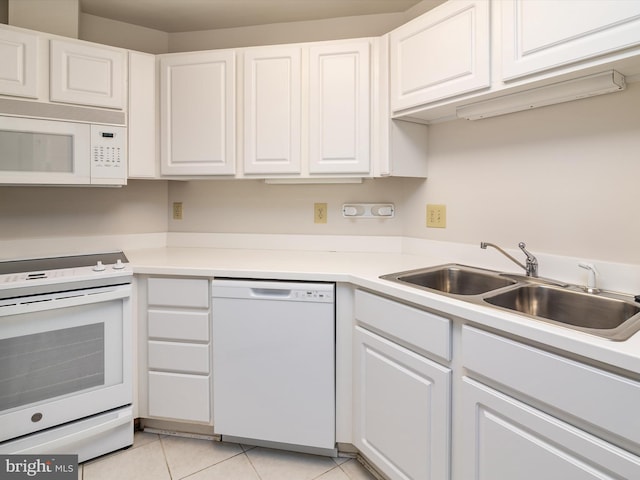 7101 Bay Front Dr Unit 204, Annapolis, MD 21403 - kitchen featuring white appliances, white cabinets, light tile patterned flooring, and light countertops