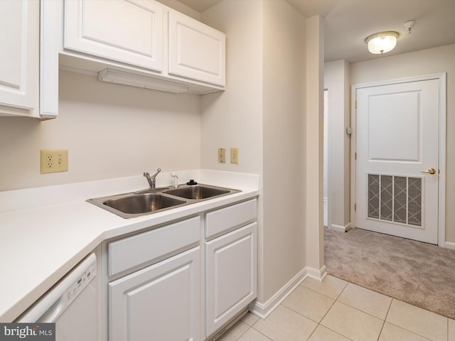 7101 Bay Front Dr Unit 204, Annapolis, MD 21403 - kitchen featuring white dishwasher, light carpet, white cabinets, and light countertops