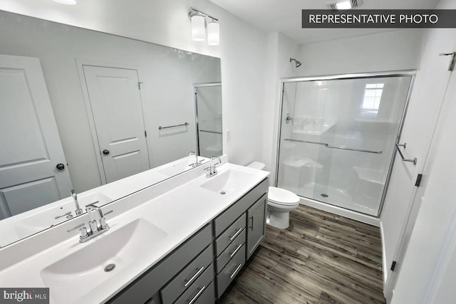 6329 Liam Dr Lot 54, Spring Grove, PA 17362 - full bath with a shower stall, wood finished floors, and double vanity