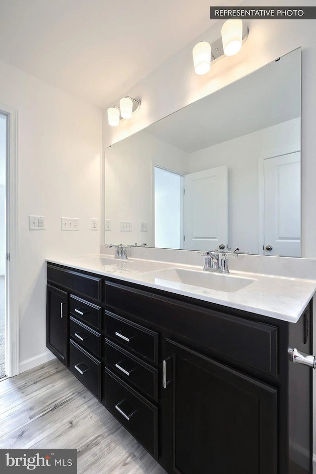 6329 Liam Dr Lot 54, Spring Grove, PA 17362 - full bathroom featuring double vanity and wood finished floors