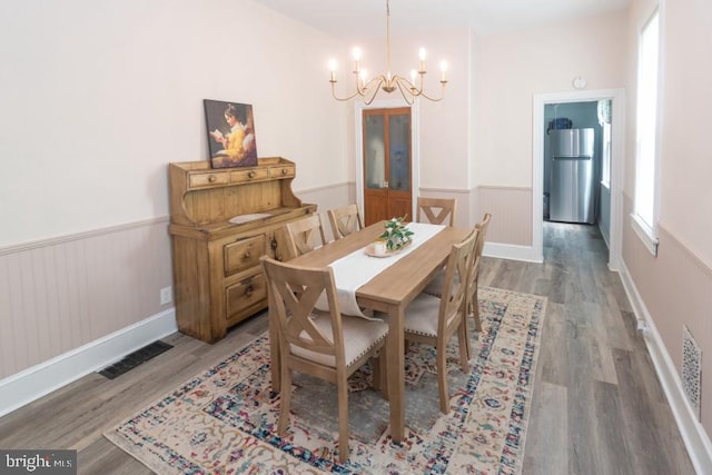 213 Conover St, Burlington, NJ 08016 - dining room featuring a chandelier, wainscoting, and wood finished floors