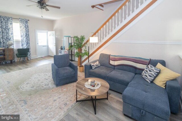 213 Conover St, Burlington, NJ 08016 - living area featuring wood finished floors, a ceiling fan, and stairs