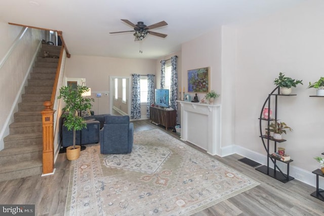 213 Conover St, Burlington, NJ 08016 - living area featuring wood finished floors, stairs, and ceiling fan
