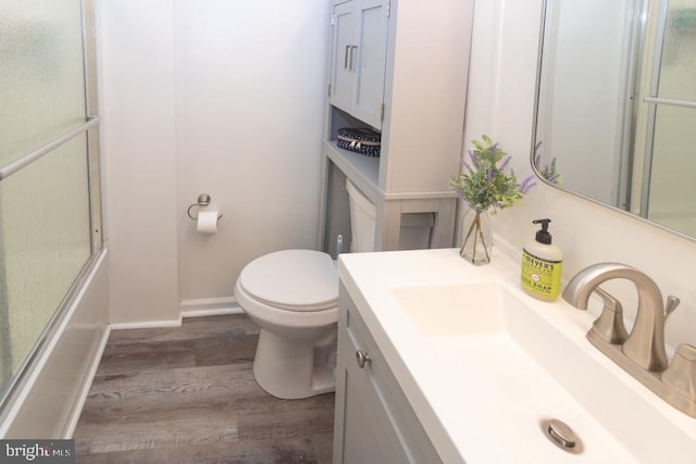 213 Conover St, Burlington, NJ 08016 - bathroom featuring vanity, wood finished floors, and bath / shower combo with glass door