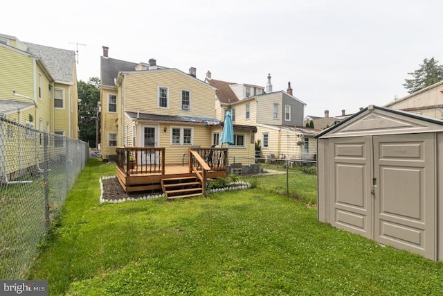 213 Conover St, Burlington, NJ 08016 - back of property with a wooden deck, a storage shed, a fenced backyard, and a residential view