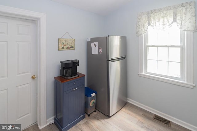 213 Conover St, Burlington, NJ 08016 - kitchen with freestanding refrigerator, butcher block counters, blue cabinetry, and light wood-type flooring
