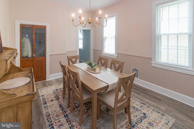 213 Conover St, Burlington, NJ 08016 - dining room with a wainscoted wall, light wood-type flooring, and a chandelier