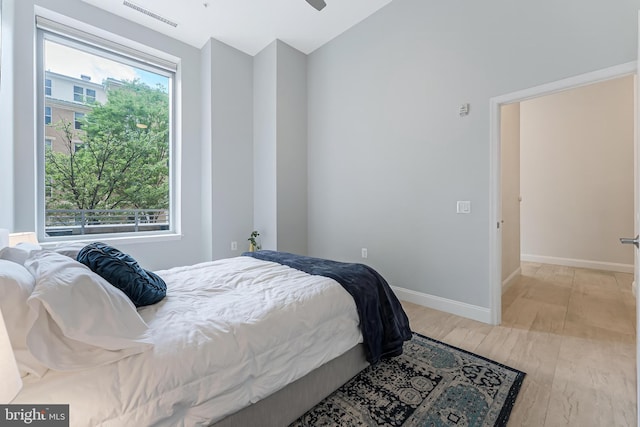 11990 Market St Unit 101, Reston, VA 20190 - bedroom with vaulted ceiling and light wood-type flooring