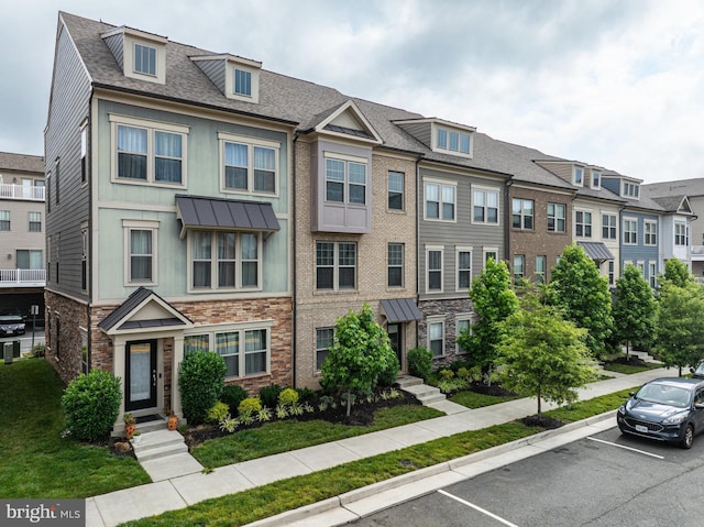 1036 Cantina Ter SE, Leesburg, VA 20175 - view of front facade with stone siding, uncovered parking, and a residential view