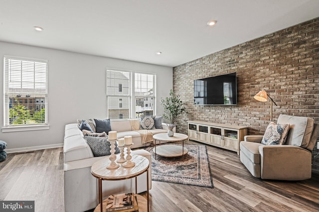 1036 Cantina Ter SE, Leesburg, VA 20175 - living room with wood finished floors, recessed lighting, and brick wall