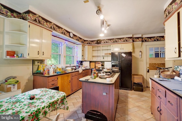 100 Springdale Rd, York, PA 17403 - kitchen featuring open shelves, black fridge, stone tile flooring, and a kitchen island